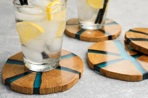 Epoxy coasters made with wood and blue resin dye.