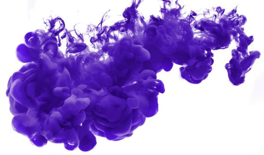Purple Dye being dispersed into a liquid.