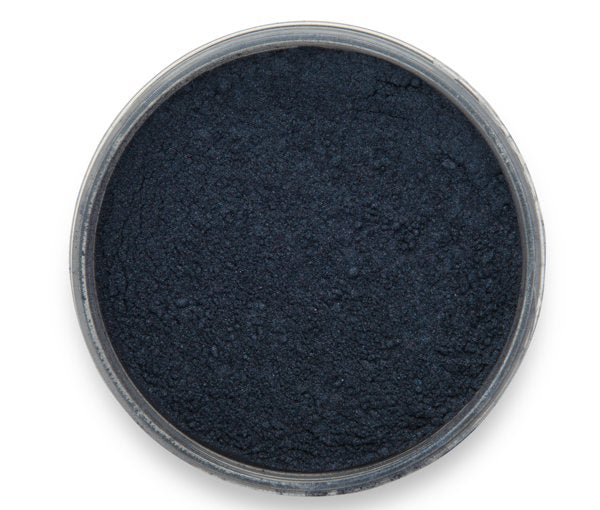 A container of Deep Space Blue, a signature blue mica by Pigmently. Seen from above with the lid removed to show the dark blue contents.