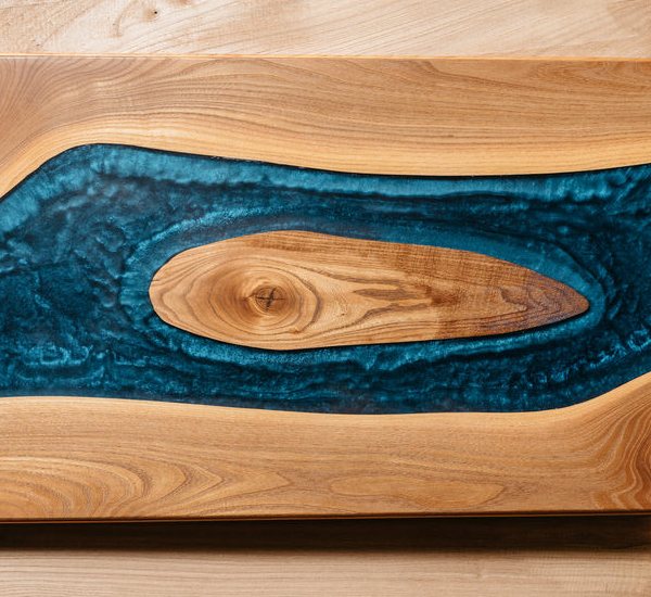 A wooden epoxy resin tray made using blue mica powder.