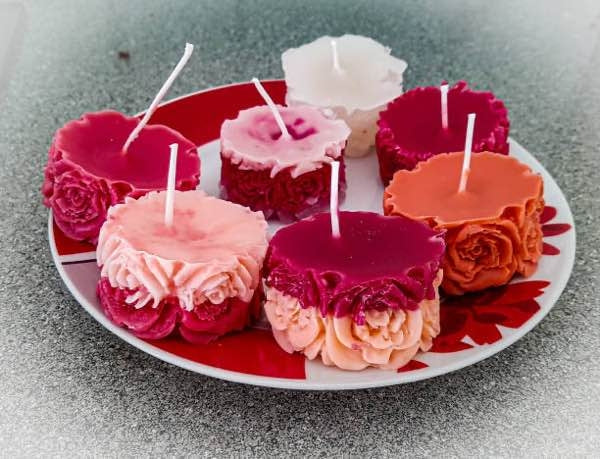A variety of vibrant candles made using mica powder pigments