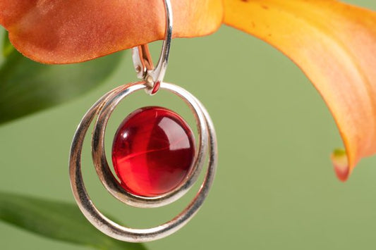 A resin earring made with red dye.