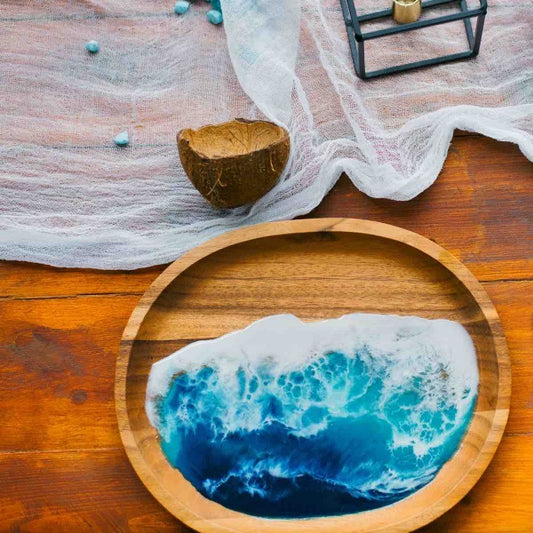 A serving tray with an epoxy resin wave finish.
