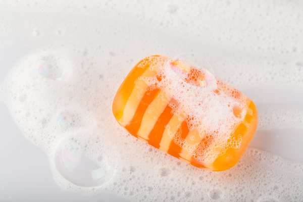 A sudsy bar of pigmented soap made using soap colorants.