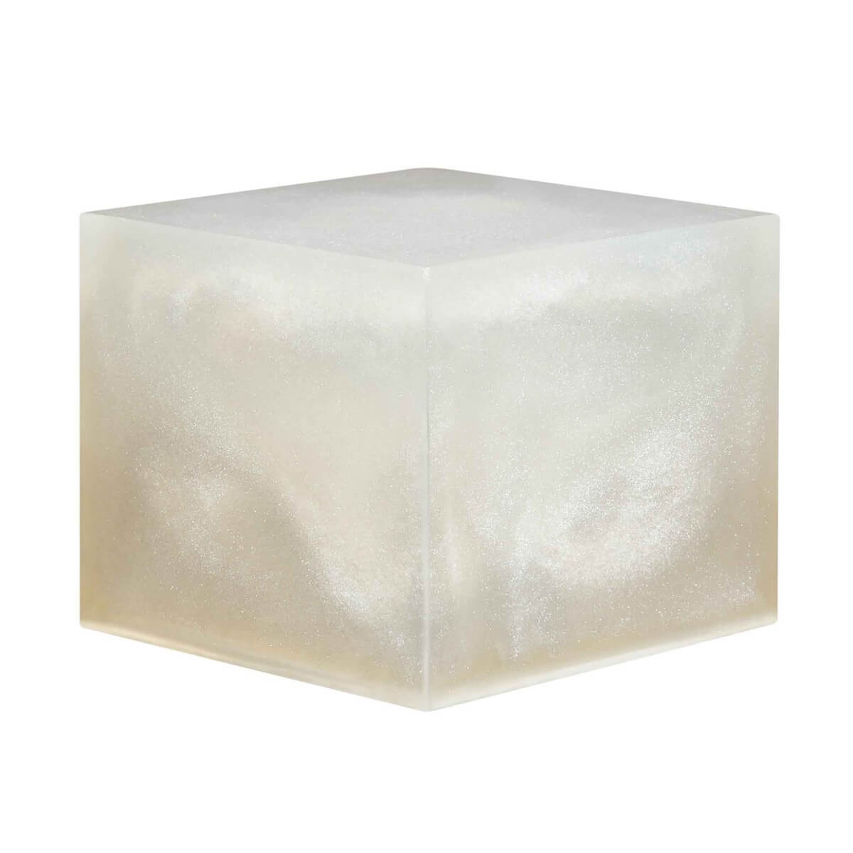 A resin cube made with the Comet Tail Dust Mica Powder Pigment by Pigmently.